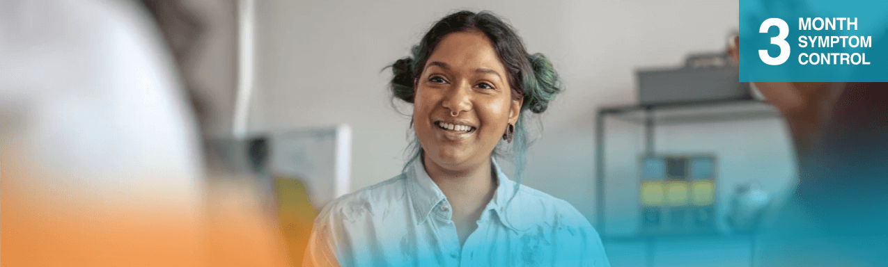 3 month symptom control: woman green hair smiling